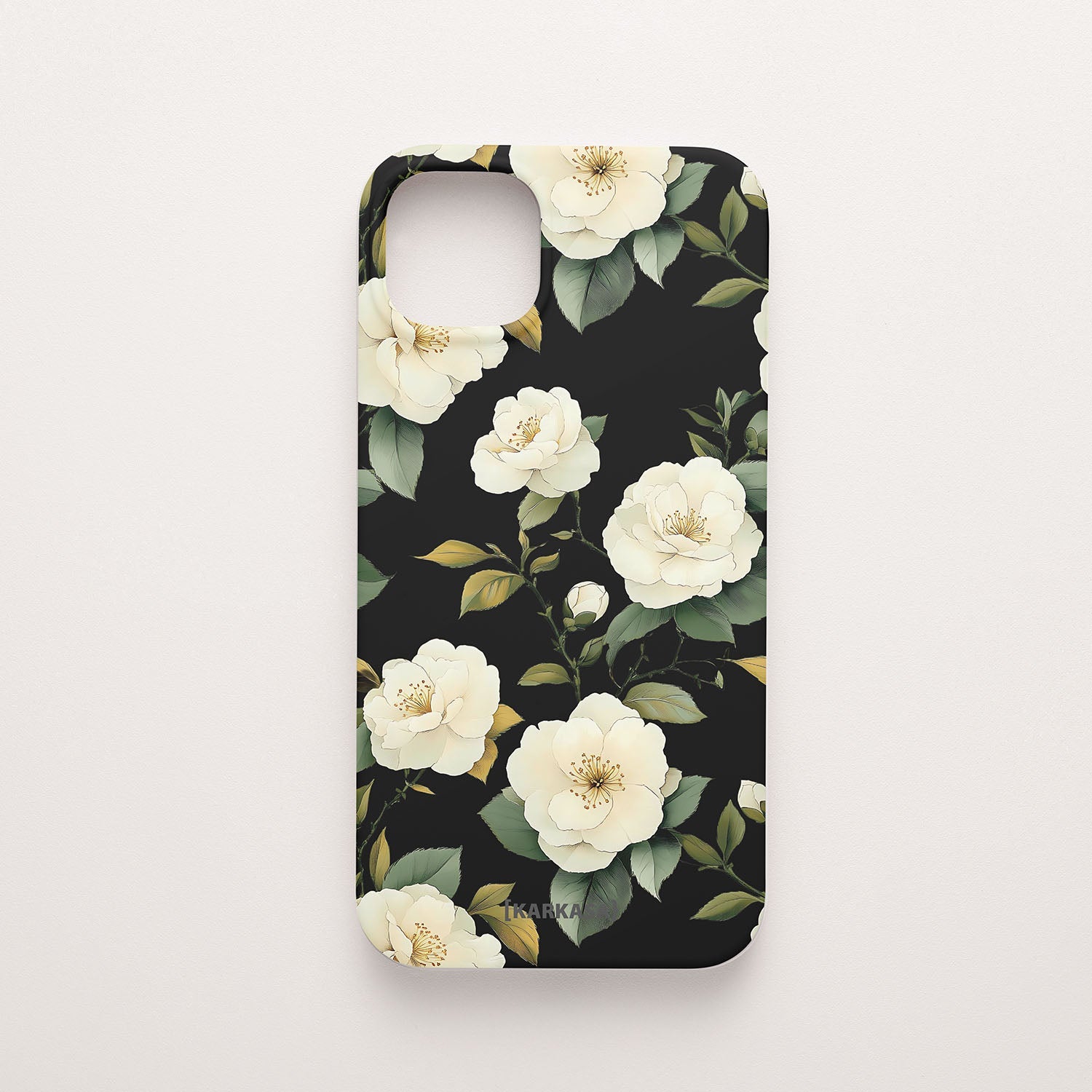 Funda móvil Camelias Serenas KARKASA en Silk Touch negra con diseño floral de camelias blancas.