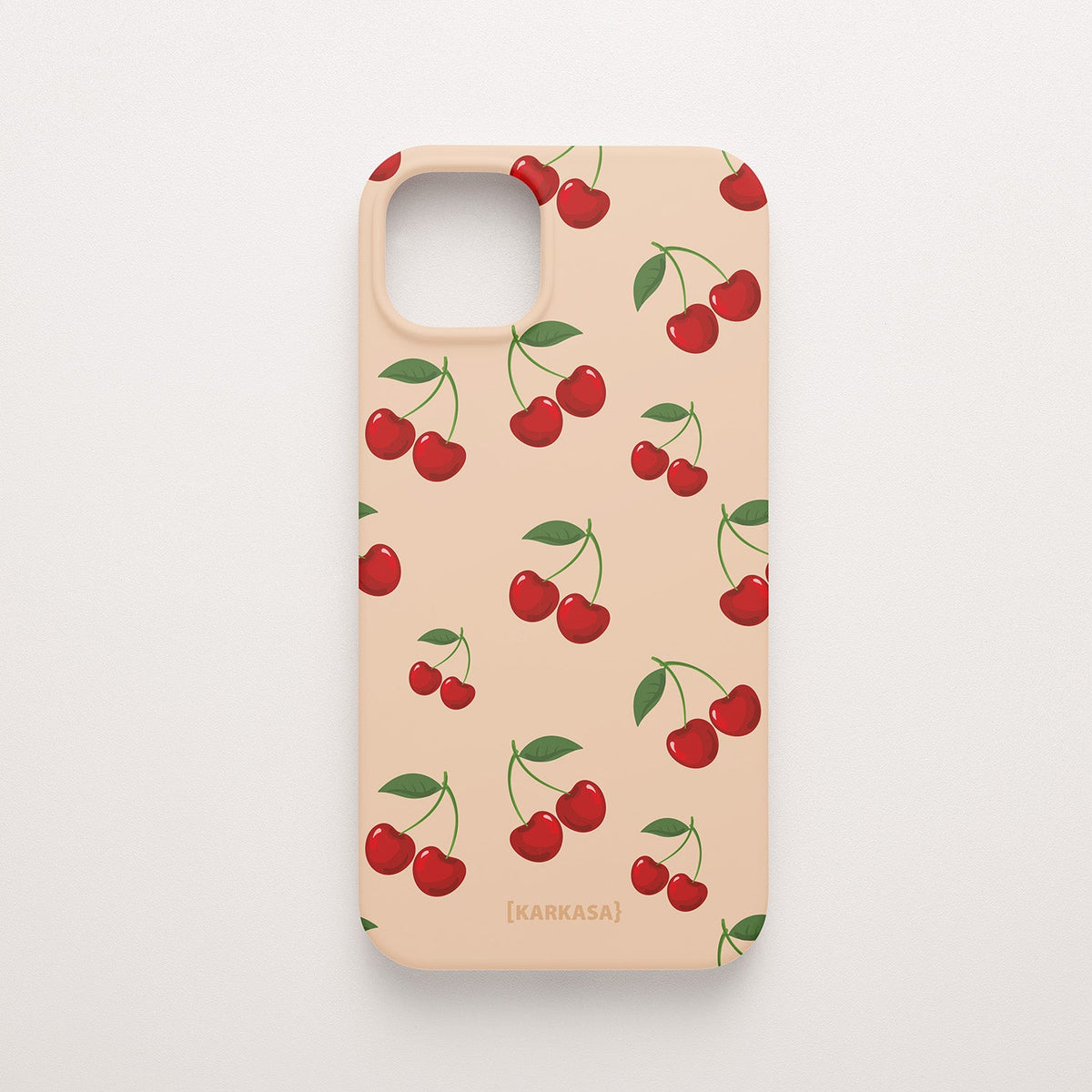 Funda KARKASA Silk Touch rosa nude con estampado pop de cerezas rojas y hojas verdes. Carcasa estilo frutal aesthetic.