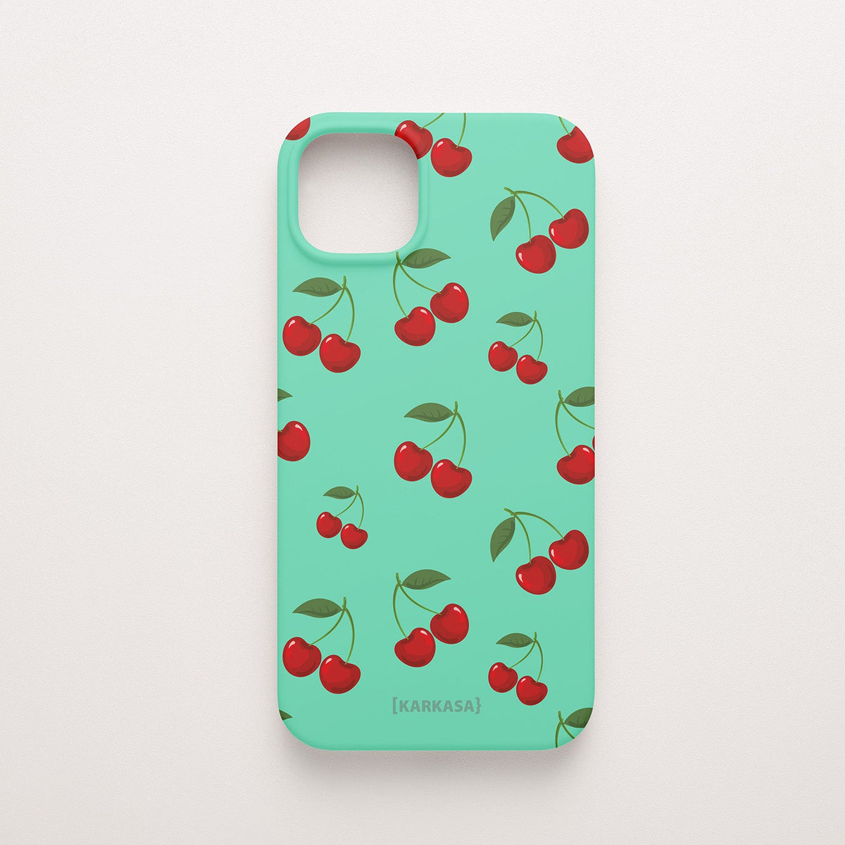 Funda KARKASA Silk Touch verde menta con estampado pop de cerezas rojas y hojas verdes. Carcasa estilo frutal aesthetic.