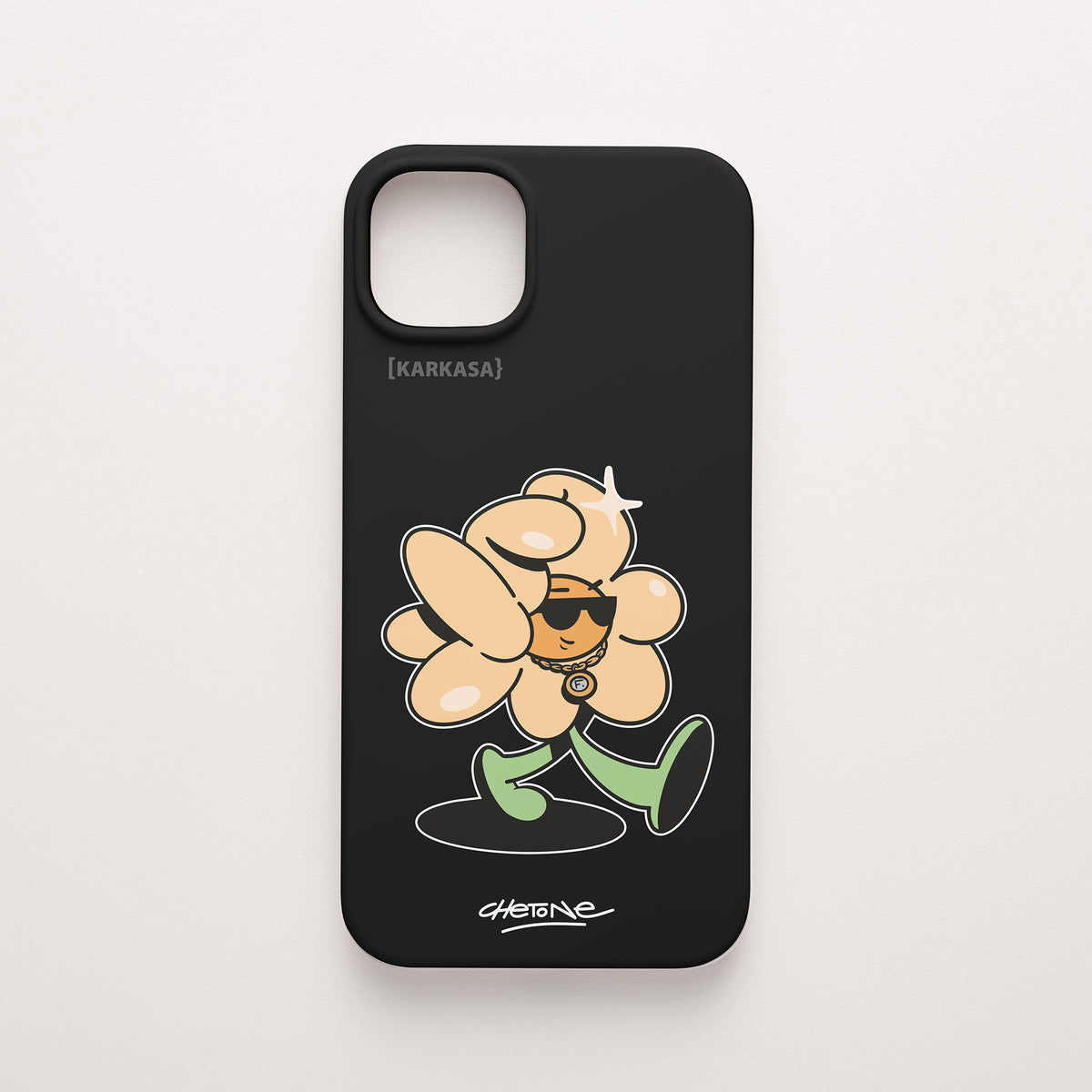 Funda de móvil de silicona negra con una flor color melocotón con gafas de sol y cadena dorada, todo perfilado en blanco, diseño Chill Grind de Chetone Sánchez para KARKASA.
