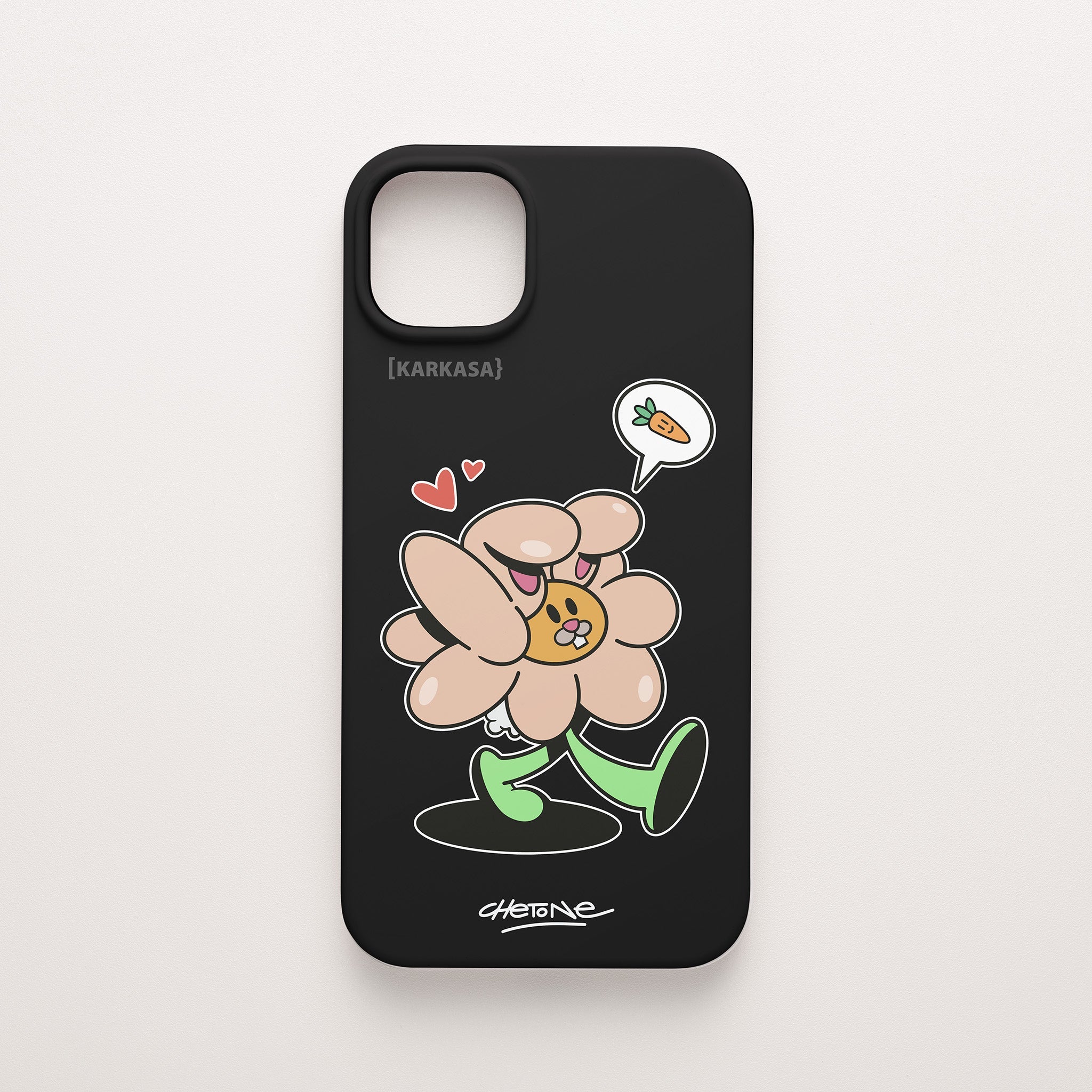 Funda de móvil de silicona negra con una flor rosa con orejas de conejo y corazones perfilada en blanco, diseño Good Bunny de Chetone Sánchez para KARKASA.