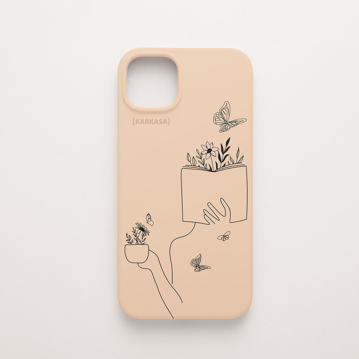 Funda de móvil KARKASA con ilustración lineal negra de una figura leyendo con flores y mariposas, en silicona mate Silk Touch rosa nude.