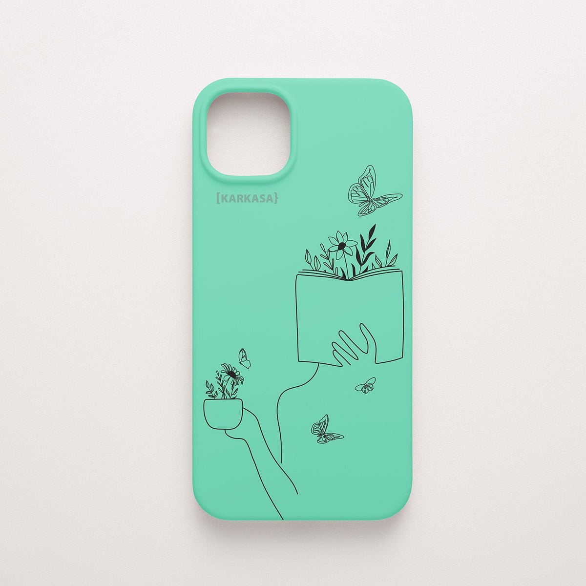 Funda de móvil KARKASA con ilustración lineal negra de una figura leyendo con flores y mariposas, en silicona mate Silk Touch verde menta.