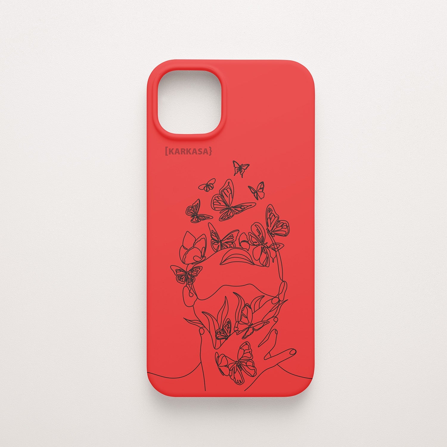 Funda de móvil KARKASA con diseño lineal negro de silueta de mujer y mariposas, en silicona mate Silk Touch roja.