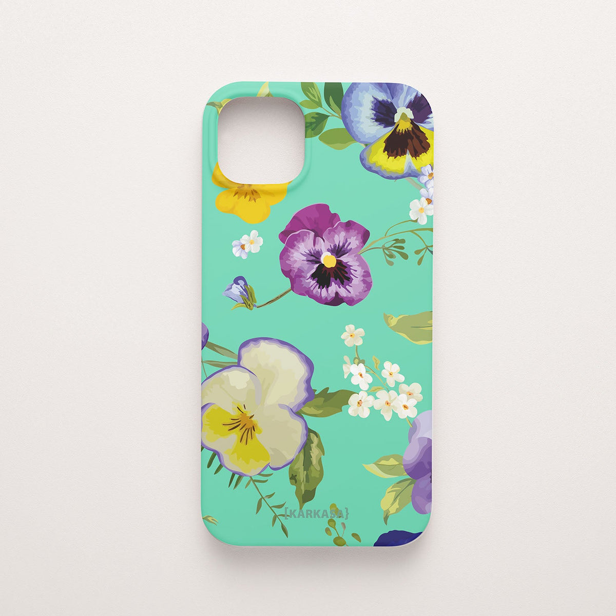 Funda móvil Pensamientos de Ensueño KARKASA en Silk Touch verde menta con diseño floral de pensamientos amarillos, violetas y azules.