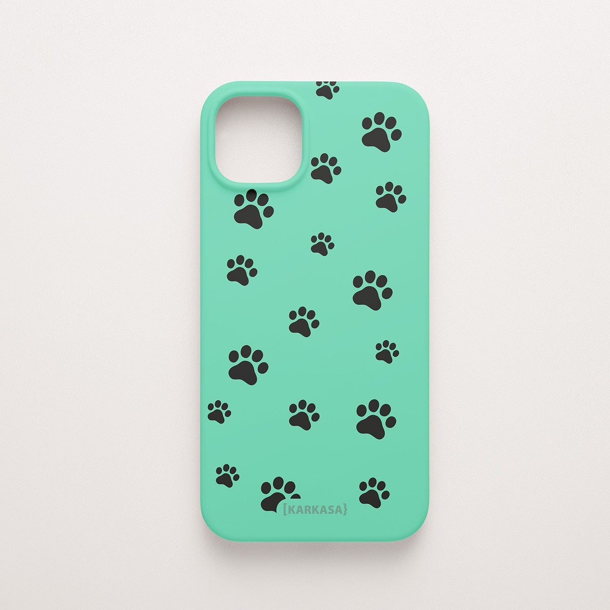 Funda KARKASA Silk Touch verde menta con patrón minimalista de huellas de perro o gato en negro. Carcasa mate de silicona para smartphone.