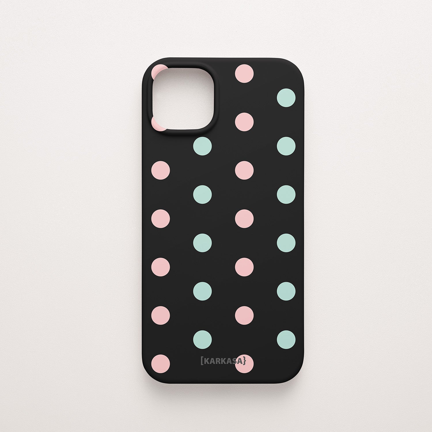Funda KARKASA Silk Touch negra con estampado de lunares en colores rosa pastel y verde menta. Carcasa diseño pop divertido.