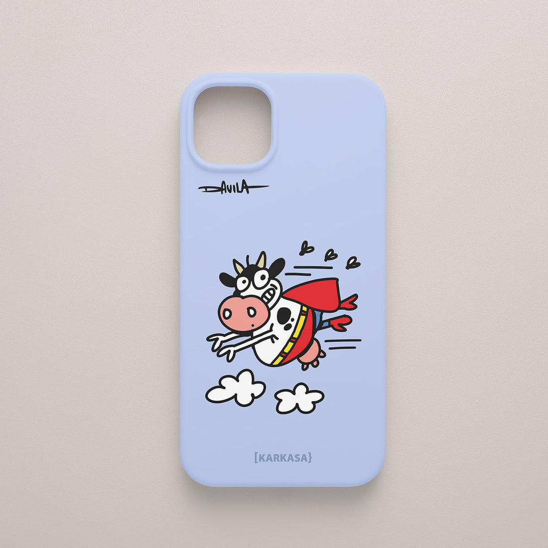 Funda azul lavanda con ilustración de una vaca volando con capa roja de superhéroe, personaje del humorista gráfico Luis Davila (O Bichero).