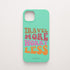 Funda KARKASA Silk Touch verde menta con frase Travel More Worry Less en letras retro de colores naranjas y rosas. Carcasa para viajeros.