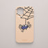 Funda móvil rosa nude KARKASA con diseño Araña de Luis Davila, tela de araña y personaje ilustrado de O Bichero