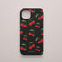 Funda KARKASA Silk Touch negra con estampado pop de cerezas rojas y hojas verdes. Carcasa estilo frutal aesthetic.