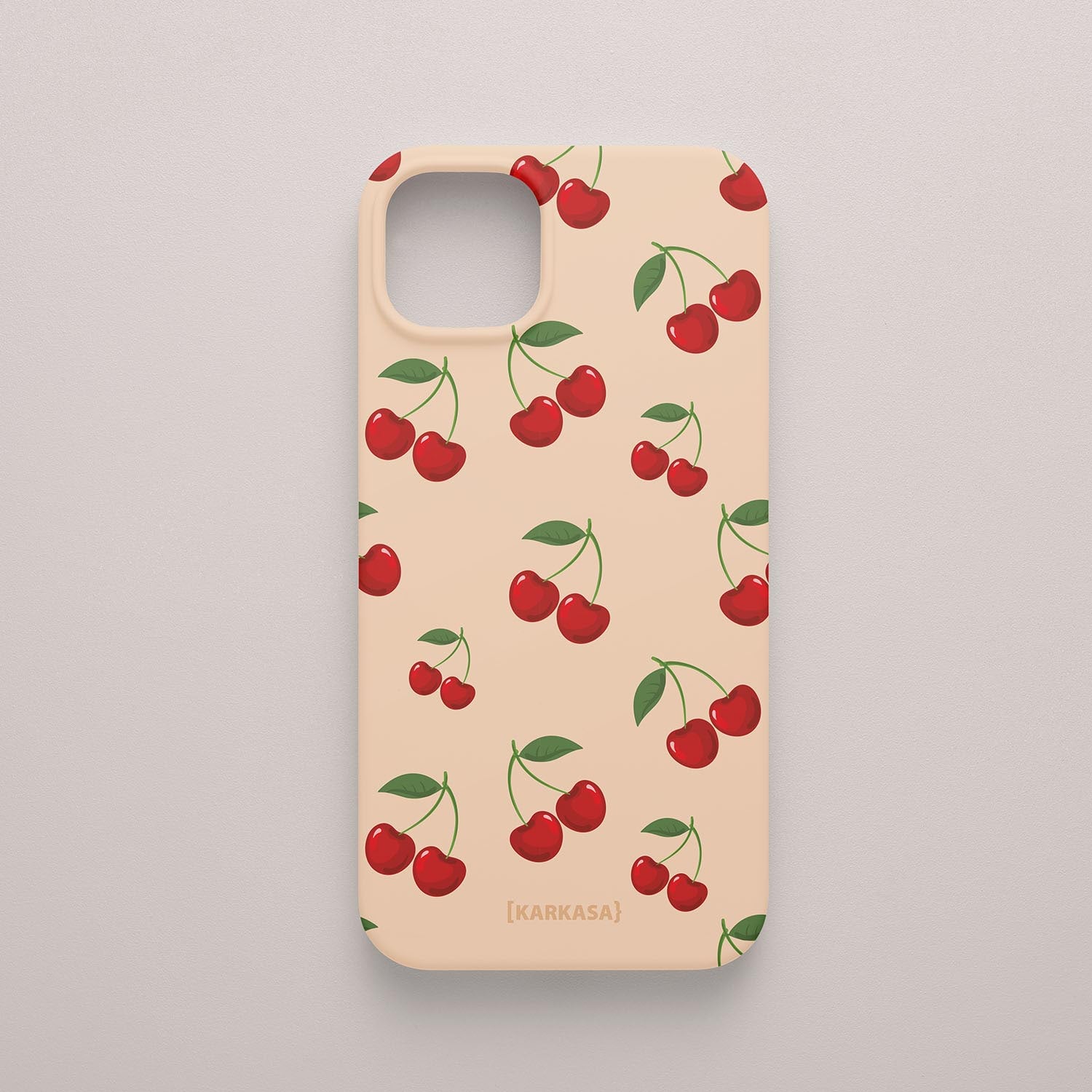 Funda KARKASA Silk Touch rosa nude con estampado pop de cerezas rojas y hojas verdes. Carcasa estilo frutal aesthetic.