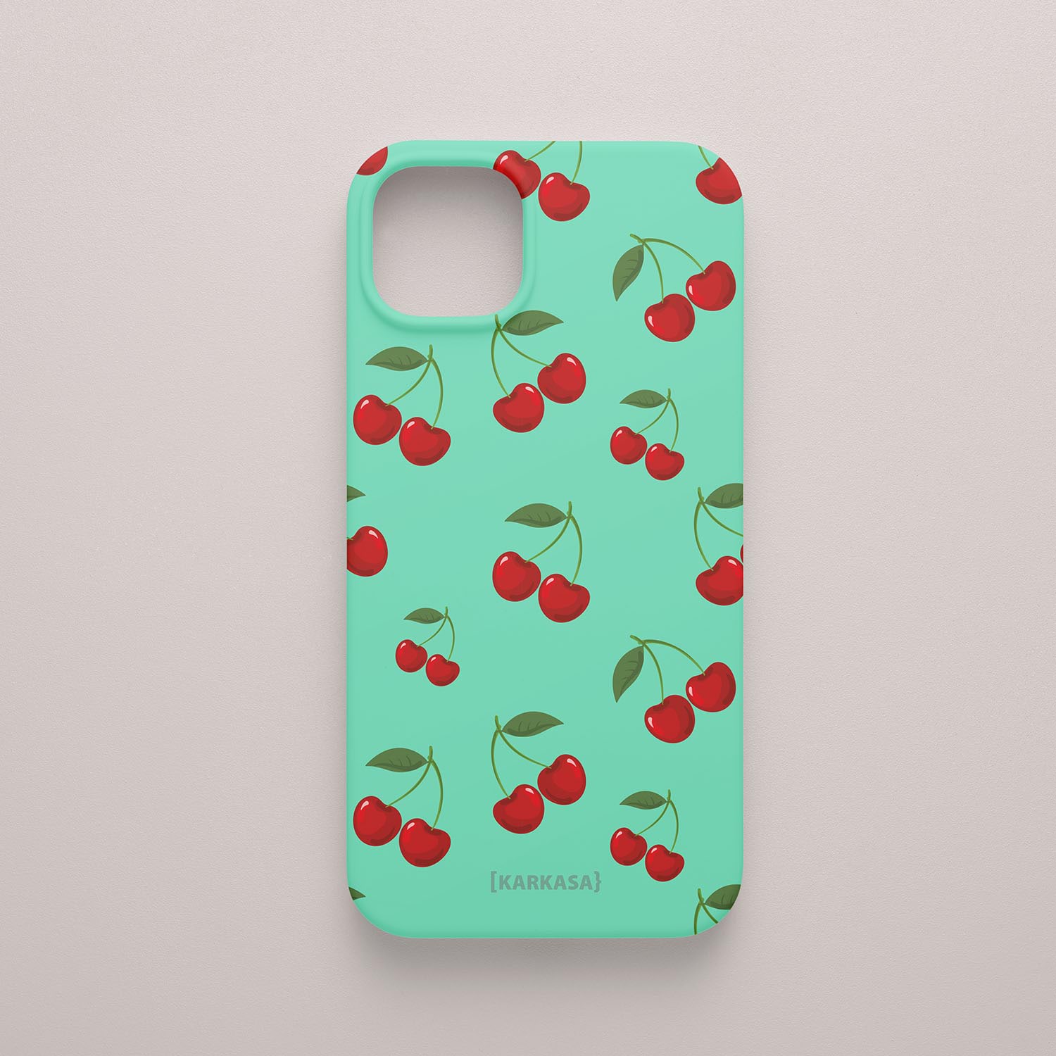 Funda KARKASA Silk Touch verde menta con estampado pop de cerezas rojas y hojas verdes. Carcasa estilo frutal aesthetic.