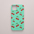 Funda KARKASA Silk Touch verde menta con estampado pop de cerezas rojas y hojas verdes. Carcasa estilo frutal aesthetic.