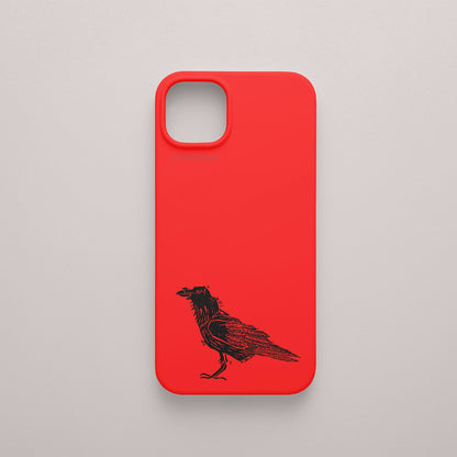 Funda KARKASA roja con ilustración minimalista de un cuervo negro posado, dibujo en tinta del artista Daniel Buitrón.
