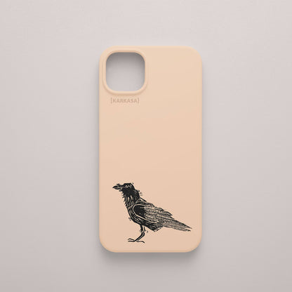 Funda KARKASA rosa nude con ilustración minimalista de un cuervo negro posado, dibujo en tinta del artista Daniel Buitrón.