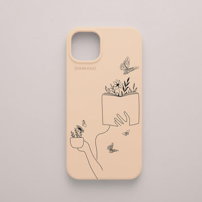 Funda de móvil KARKASA con ilustración lineal negra de una figura leyendo con flores y mariposas, en silicona mate Silk Touch rosa nude.